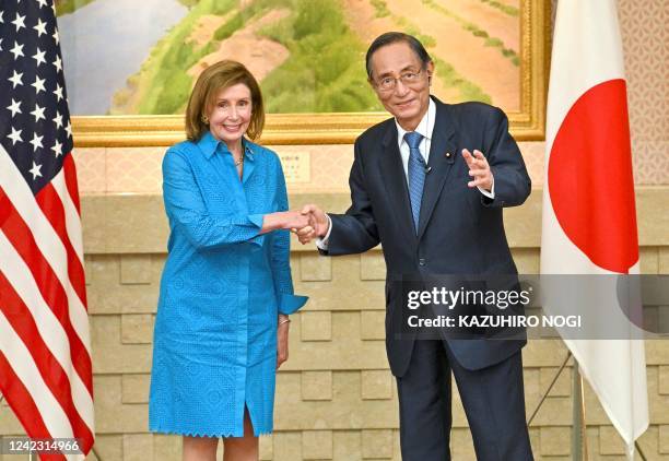 House Speaker Nancy Pelosi shakes hands with Hiroyuki Hosoda, speaker of Japans House of Representatives, during a meeting in Tokyo on August 5,...