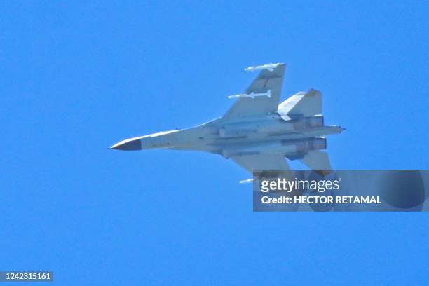 Chinese military jet flies over Pingtan island, one of mainland China's closest point from Taiwan, in Fujian province on August 5, 2022. - Taiwan...