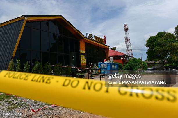 Police tape is pictured around the Mountain B nightclub after a deadly fire in Sattahip district in Thailand's Chonburi province on August 5, 2022. -...