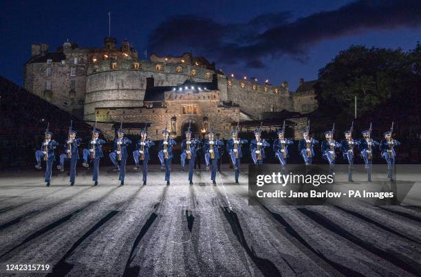 Members of the US Air Force Honor Guard Drill Team perform on the Esplanade of Edinburgh Castle at this year's Royal Edinburgh Military Tattoo. After...