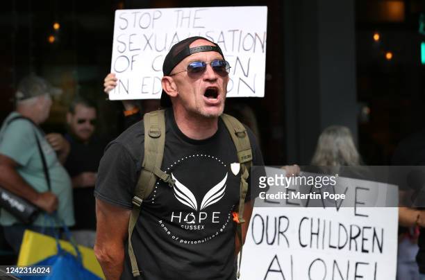 Protester against drag queens reading to children shouts at those supporting it outside Jubilee library on August 04, 2022 in Brighton, United...