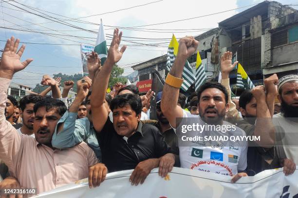People of Pakistan-administered Kashmir shout slogans during a protest against the scrapping of Article 370 of Jammu and Kashmir, to show solidarity...