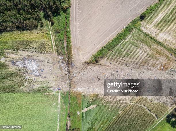 Aerial view from a drone of the scattered debris and the crash site of an Ukrainian made Antonov An-12 cargo plane with registration UR-CIC belonging...