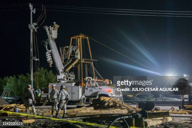 Mexican soldiers work at the coal mine where 10 miners were trapped yesterday after a collapse, in the Agujita area, Sabinas municipality, Coahuila...