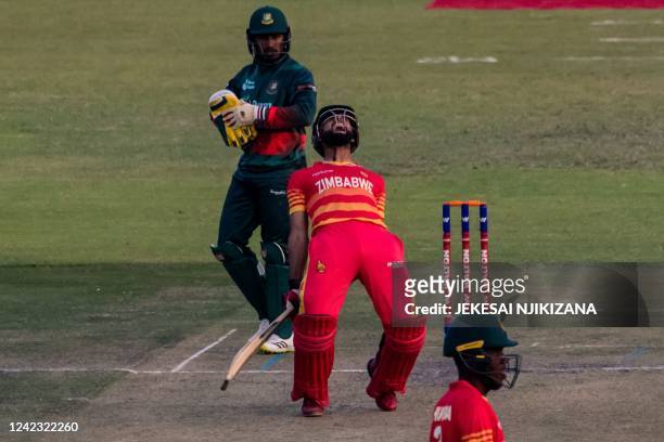 Zimbabwe's Sikandar Raza shouts as he celebrates after hitting a six leading Zimbabwe to victory during the first one-day international cricket match...
