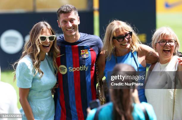 Robert Lewandowski, with his wife, Anna Lewandowska, and his mother during his presentation as a new player of FC Barcelona, in Barcelona, on 05th...