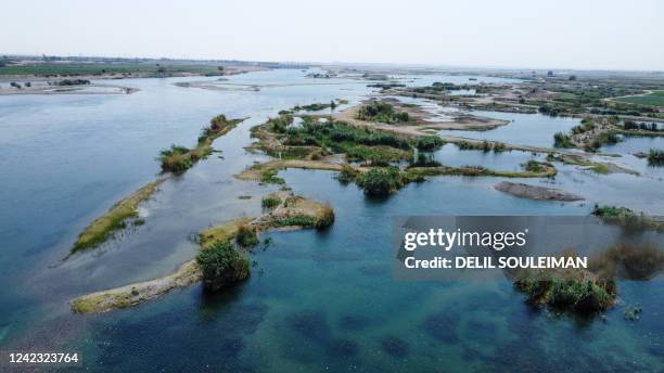 An aerial picture taken by drone on August 5 shows a general view ofthe Euphrates river in low water levels in the western country side of Raqa on...