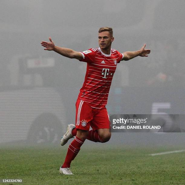 Bayern Munich's German midfielder Joshua Kimmich celebrates scoring the 1-0 goal during the German first division Bundesliga football match between...