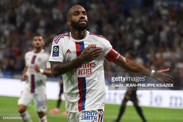 Lyon's French forward Alexandre Lacazette celebrates after scoring his team's second goal during the French L 1 football match between Olympique...