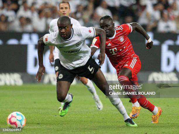 Frankfurt's French defender Evan N'Dicka and Bayern Munich's Senegalese forward Sadio Mane vie for the ball during the German first division...