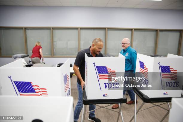 Linda Wetherington, a volunteer election worker unloads voting booths for assembly at the Robert L. Gilder Elections Service Center on August 5, 2022...