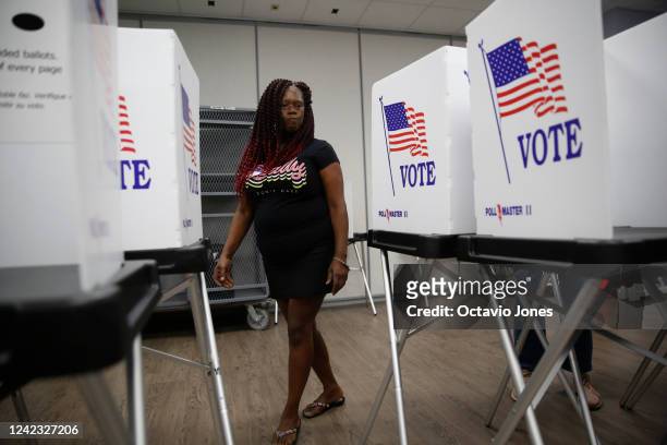 Sheila Brewer, a volunteer election worker assembles voting booths at the Robert L. Gilder Elections Service Center on August 5, 2022 in Tampa,...