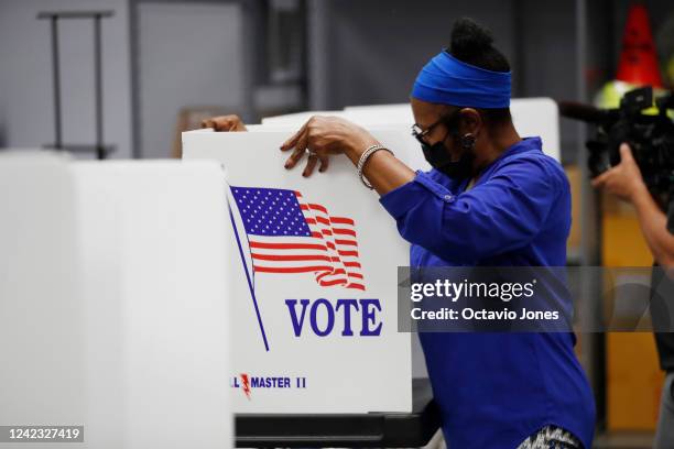 Jessie Finlayson, a volunteer election worker assembles voting booths at the Robert L. Gilder Elections Service Center on August 5, 2022 in Tampa,...