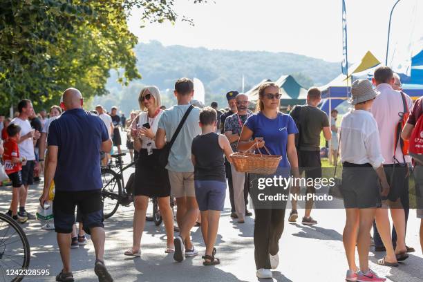 Cycling fans enjoy their time during the festyn on the finish line in Blonie Park as the cyclist will enter the finish line later this afternoon...