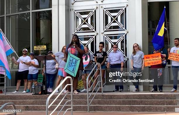 Shea Cutliff, of RISE Coalition, during a rally against a proposed ban against gender-affirming care for transgender children and teens on July 31 at...