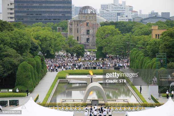 Gather gather to attend the annual memorial ceremony at the Hiroshima Peace Memorial Park in Hiroshima on August 6 to mark 77 years since the world's...