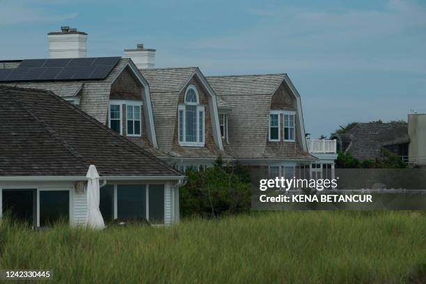 Beach houses lining Southampton beach on July 26, 2022. - In the Hamptons, New York's playground for the rich and famous, a Native American tribe is...