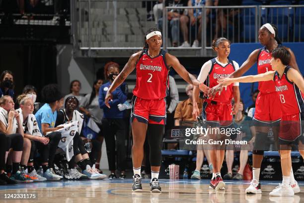 Myisha Hines-Allen of the Washington Mystics high fives team mates during the game against the Chicago Sky on August 5, 2022 at the Wintrust Arena in...