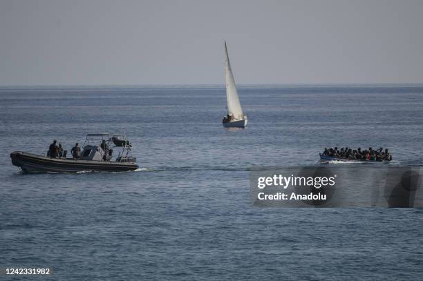 Boat seen sailing on the back of migrants and officers in Lampedusa, Italy on August 04, 2022. Three landing operations of migrants, nearly 100...