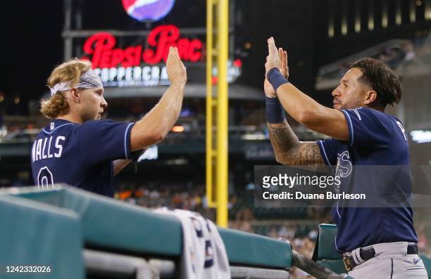 Taylor Walls of the Tampa Bay Rays celebrates with David Peralta after scoring on a double by Brandon Lowe to take a 4-3 lead over the Detroit Tigers...