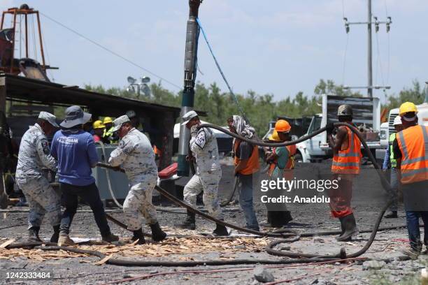 Mexican soldiers and rescue personnel work to rescue 10 miners trapped at the coal mine since Wednesday after a collapse, in Sabinas, Coahuila ,...