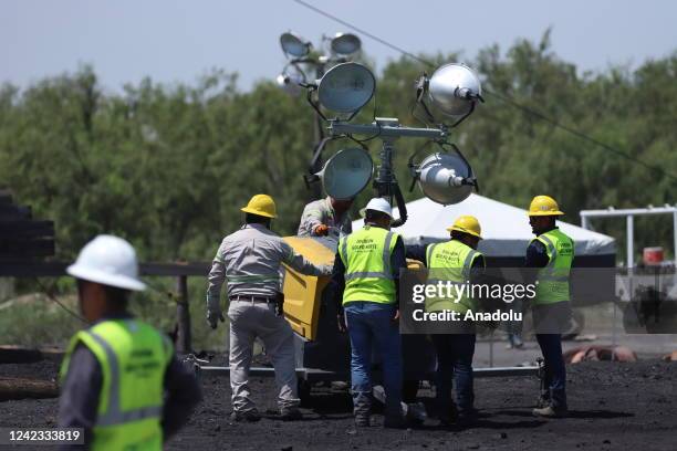 Mexican soldiers and rescue personnel work to rescue 10 miners trapped at the coal mine since Wednesday after a collapse, in Sabinas, Coahuila ,...