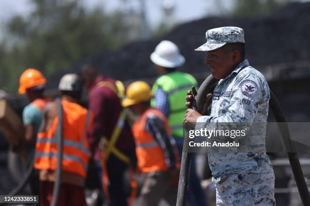 Mexican soldiers and rescue personnel work to rescue 10 miners trapped at the coal mine since Wednesday after a collapse, in Sabinas, Coahuila ,...