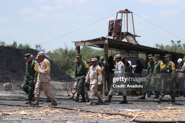 Mexican soldiers and rescue personnel work to rescue 10 miners trapped at the coal mine since Wednesday after a collapse, in Sabinas, Coahuila ,...