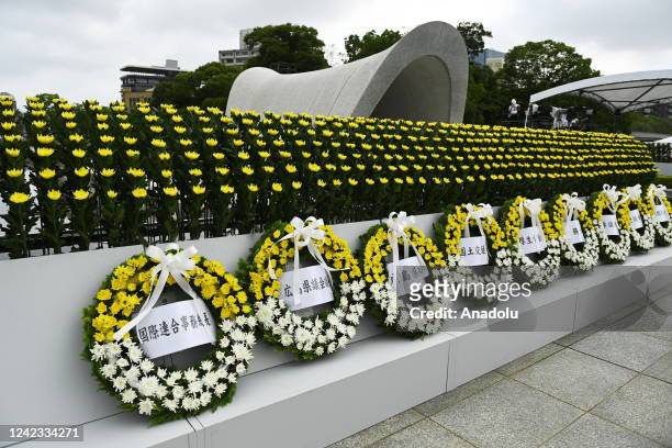Wreath of flowers are seen in front of the cenotaph for the victims of the world's first atomic bombing during the 77th anniversary of the day of the...