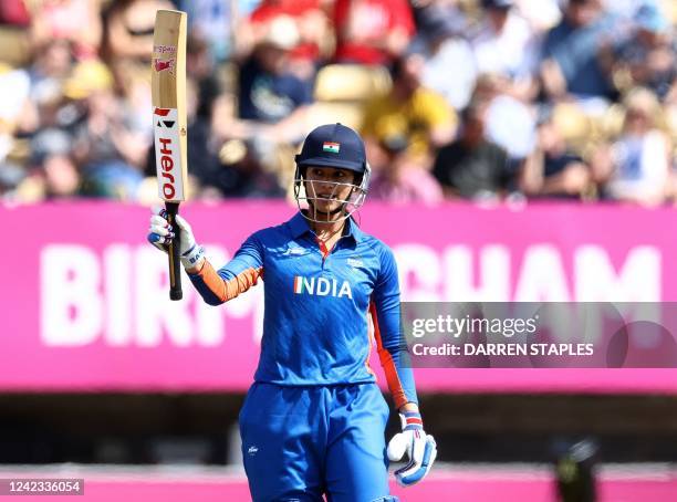 India's Smriti Mandhana acknowledges her fifty runs during the women's Twenty20 Cricket semi-final match between India and England on day nine of the...