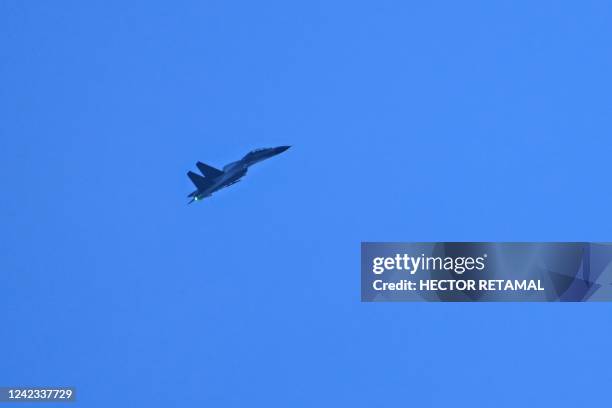 Chinese military jet flies over Pingtan island, one of mainland China's closest points to Taiwan, in Fujian province on August 6, 2022. - Taiwan...