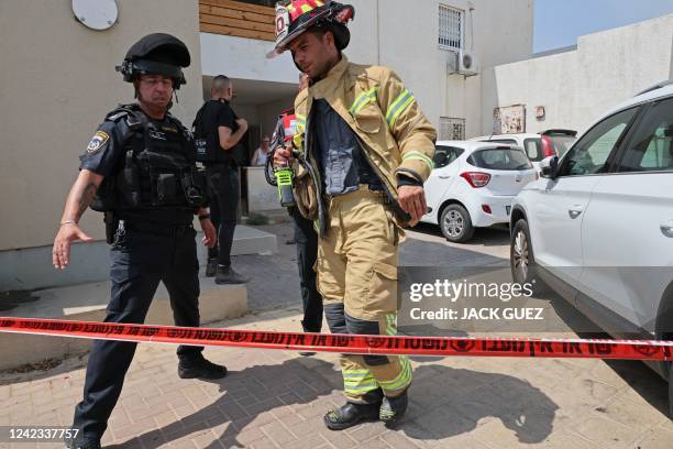 Israeli police cordon off a building in the southern Israeli city of Sderot on August 6, 2022 following a rocket attack fired from the Gaza Strip. -...