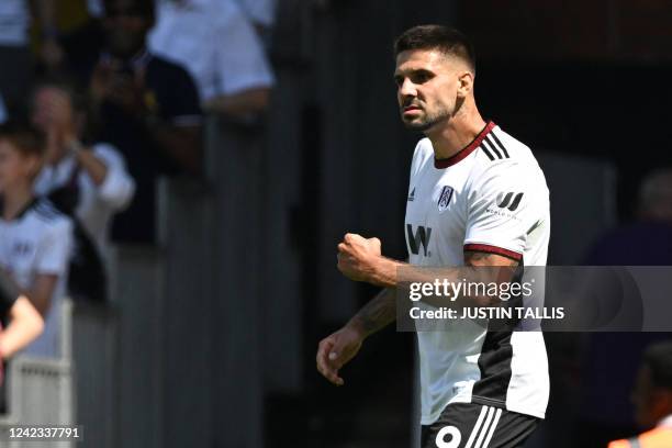 Fulham's Serbian striker Aleksandar Mitrovic celebrates after scoring the opening goal of the English Premier League football match between Fulham...