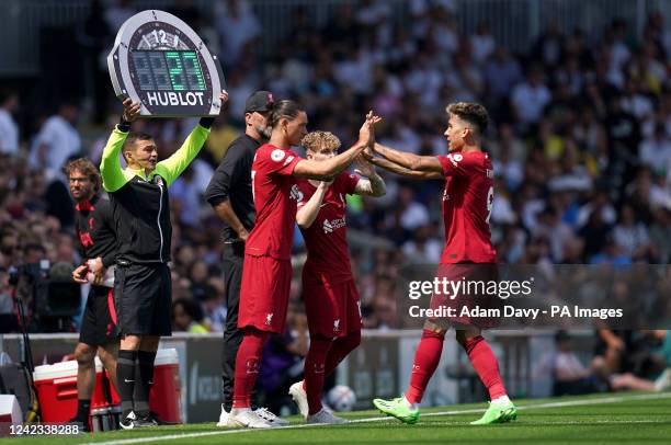 Liverpool's Darwin Nunez replaces team-mate Roberto Firmino during the Premier League match at Craven Cottage, London. Picture date: Saturday August...