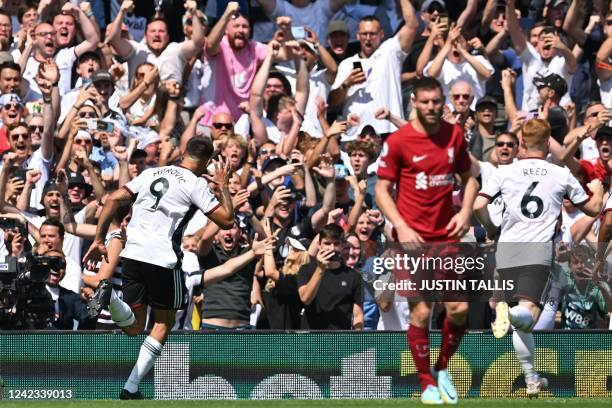 Fulham's Serbian striker Aleksandar Mitrovic celebrates after scoring their second goal from the penalty spot during the English Premier League...