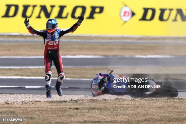 Honda Castrol's Spanish rider Alex Marquez gestures towards another rider after crashing during the MotoGP qualifying session of the British Grand...