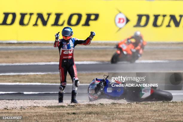 Honda Castrol's Spanish rider Alex Marquez gestures towards another rider after crashing during the MotoGP qualifying session of the British Grand...