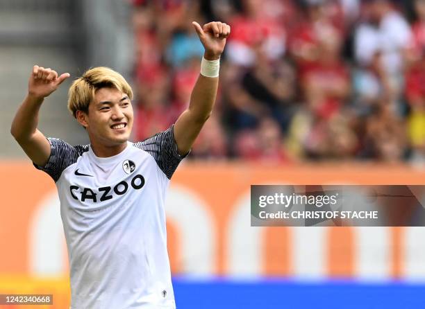 Freiburg's Japanese midfielder Ritsu Doan reacts during the German first division football Bundesliga match between FC Augsburg 1907 and SC Freiburg...