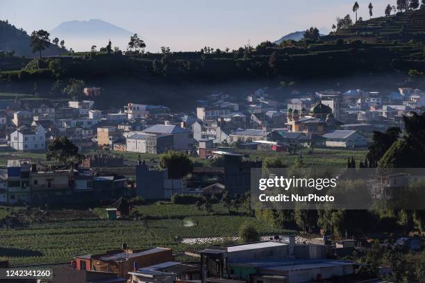 Village houses and mosques are seen in the Dieng mountain area in Banjarnegara, Central Java province, Indonesia, on August 6, 2022.