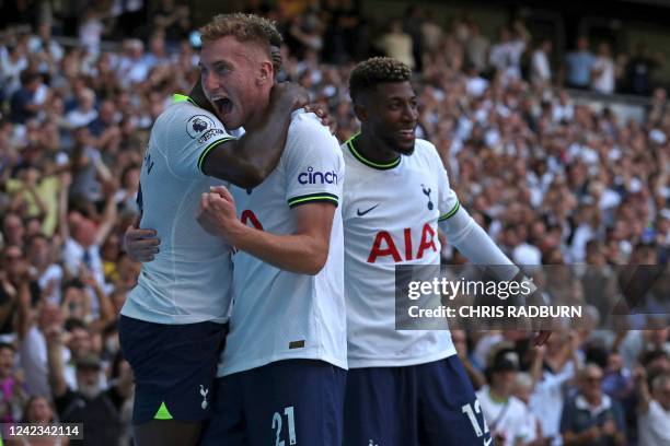 Tottenham Hotspur's Swedish midfielder Dejan Kulusevski celebrates with teammates after scoring their fourth goal during the English Premier League...