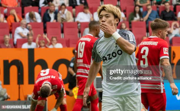 August 2022, Bavaria, Augsburg: Soccer, Bundesliga, FC Augsburg - SC Freiburg, Matchday 1, WWK-Arena. Freiburg's Ritsu Doan celebrates after his goal...