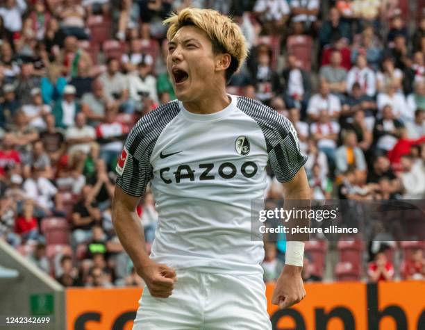 August 2022, Bavaria, Augsburg: Soccer, Bundesliga, FC Augsburg - SC Freiburg, Matchday 1, WWK-Arena. Freiburg's Ritsu Doan celebrates after his goal...