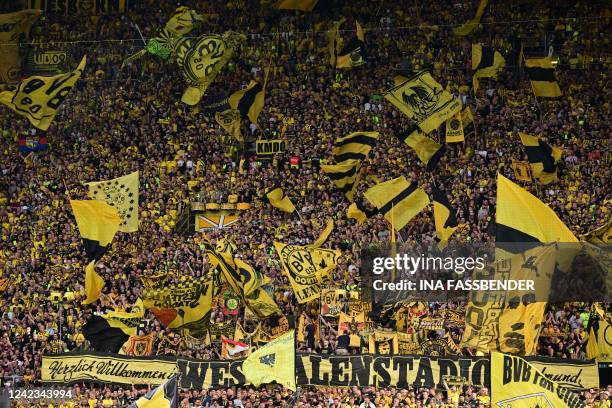 Dortmund fans wave their flags prior to the German first division Bundesliga football match between BVB Borussia Dortmund and Bayer 04 Leverkusen in...