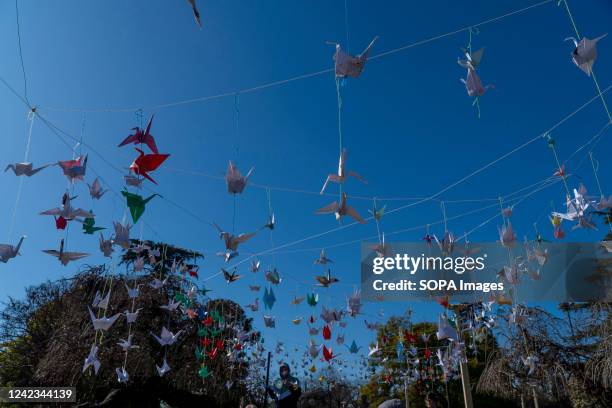 Thousand origami cranes seen hanging during "A Day for Peace" event marking the 77th anniversary of the atomic bombing of Hiroshima by the USA.