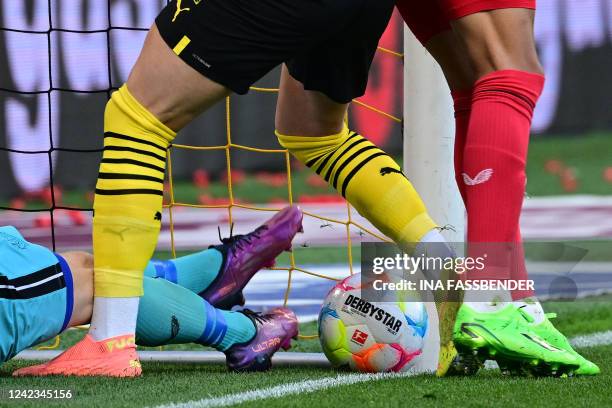 Dortmund's German forward Marco Reus helps the ball over the line to score the opening goal during the German first division Bundesliga football...