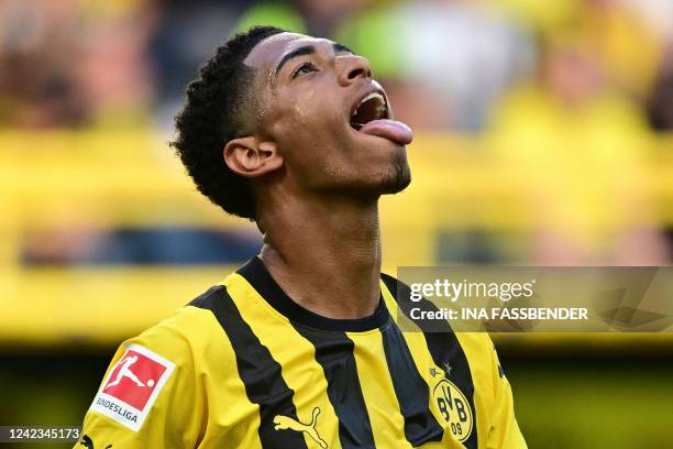 Dortmund's English midfielder Jude Bellingham reacts after a missed chance during the German first division Bundesliga football match between BVB...