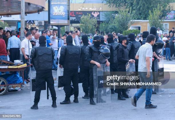 Security forces deploy during a rally called for by the New Generation Movement, a Kurdish opposition party, in Iraq's northeastern city of...