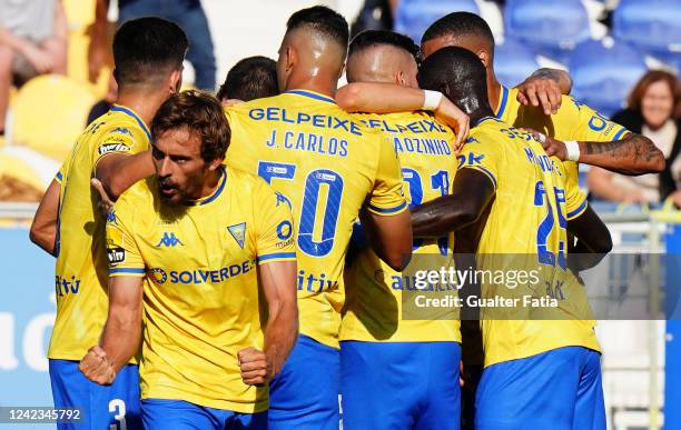 Francisco Geraldes of GD Estoril Praia celebrates with teammates after scoring a goal during the Liga Bwin match between GD Estoril Praia and FC...