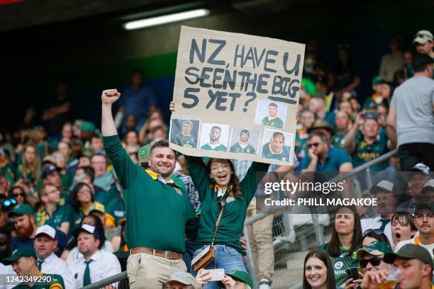 South Africa supporters hold a placard ahead of the Rugby Championship international rugby match between South Africa and New Zealand at the Mbombela...