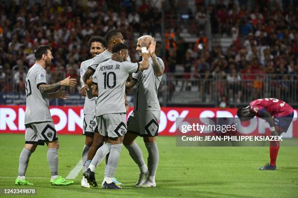 Paris Saint-Germain's Argentinian forward Lionel Messi celebrates with teammates after scoring a goal during the French L1 football match between...